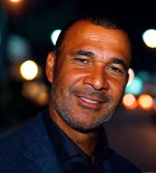 Ruud Gullit headshot — Ballon d’Or-winning football legend and leadership keynote speaker