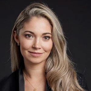 Dr Julia Shaw, memory scientist and co-founder of Spot, on stage for 92 Speakers deconstructing "The Memory Illusion" and the 2026 shift in ethical AI reporting.