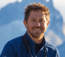 Dr Chadden Hunter, Emmy-winning BBC producer and director of 'The Raftsmen', on stage for 92 Speakers deconstructing the "Physics of Failure" and the importance of team trust in the 2026 global landscape.