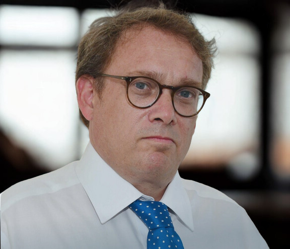 Adrian Wooldridge headshot — Bloomberg editor and keynote speaker on capitalism and institutions