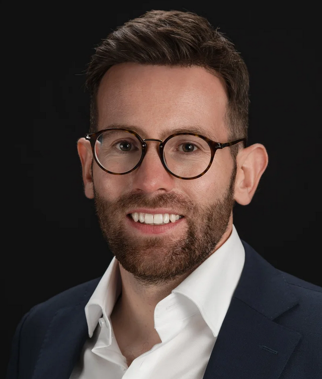 Thomas Curran headshot — psychologist, author of The Perfection Trap and keynote speaker on performance and perfectionism