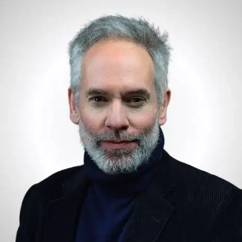 Dominic Frisby keynote speaker headshot — financial commentator and comedian