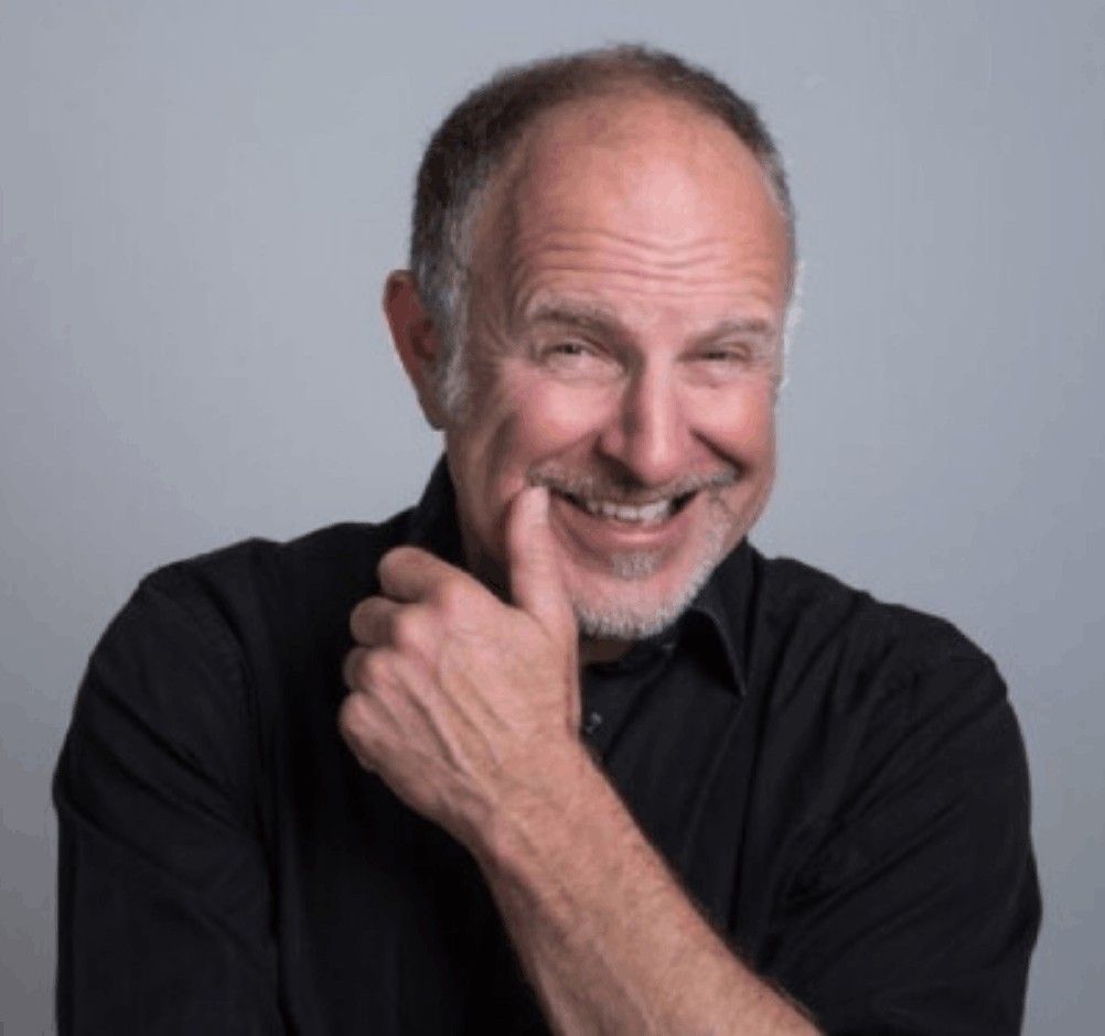 Simon Evans keynote speaker headshot — stand-up comedian and corporate entertainer