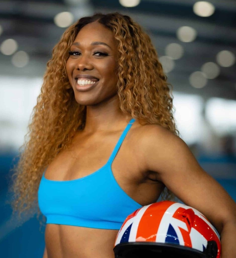 Headshot of Montell Douglas, Olympian and elite athlete keynote speaker on reinvention, resilience and high performance, represented by 92 Speakers Bureau