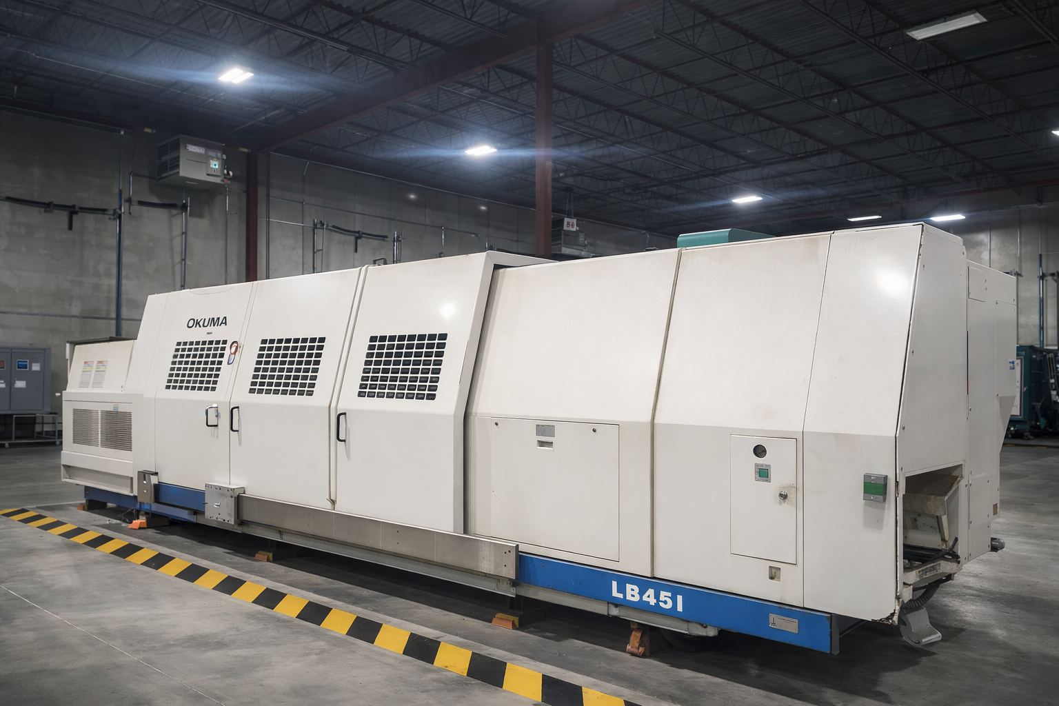 Black and white photo of cargo ships docked at a port with large cranes loading containers.