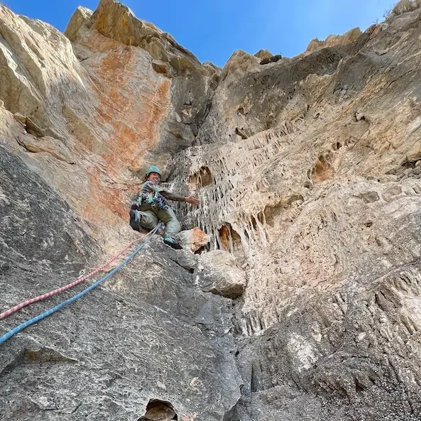 Climber on a limestone route in Granada during a guided trad climbing session