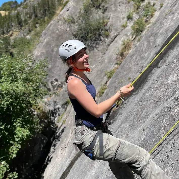 Girl climbing top rope in Granada