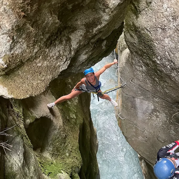 Girl smiling, having fun in a via ferrata around granada