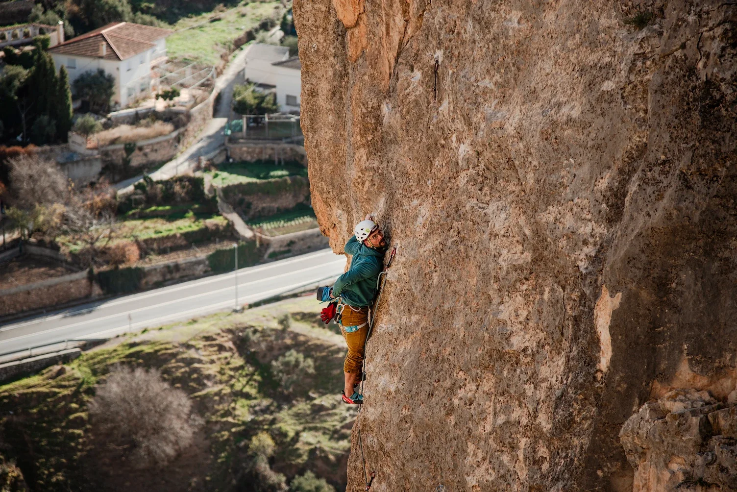 Climber climbing in Granada area, focus on slab