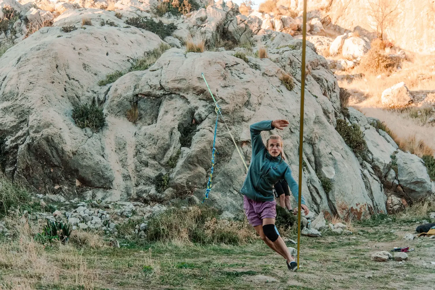 Climber practicing slackline during rest day