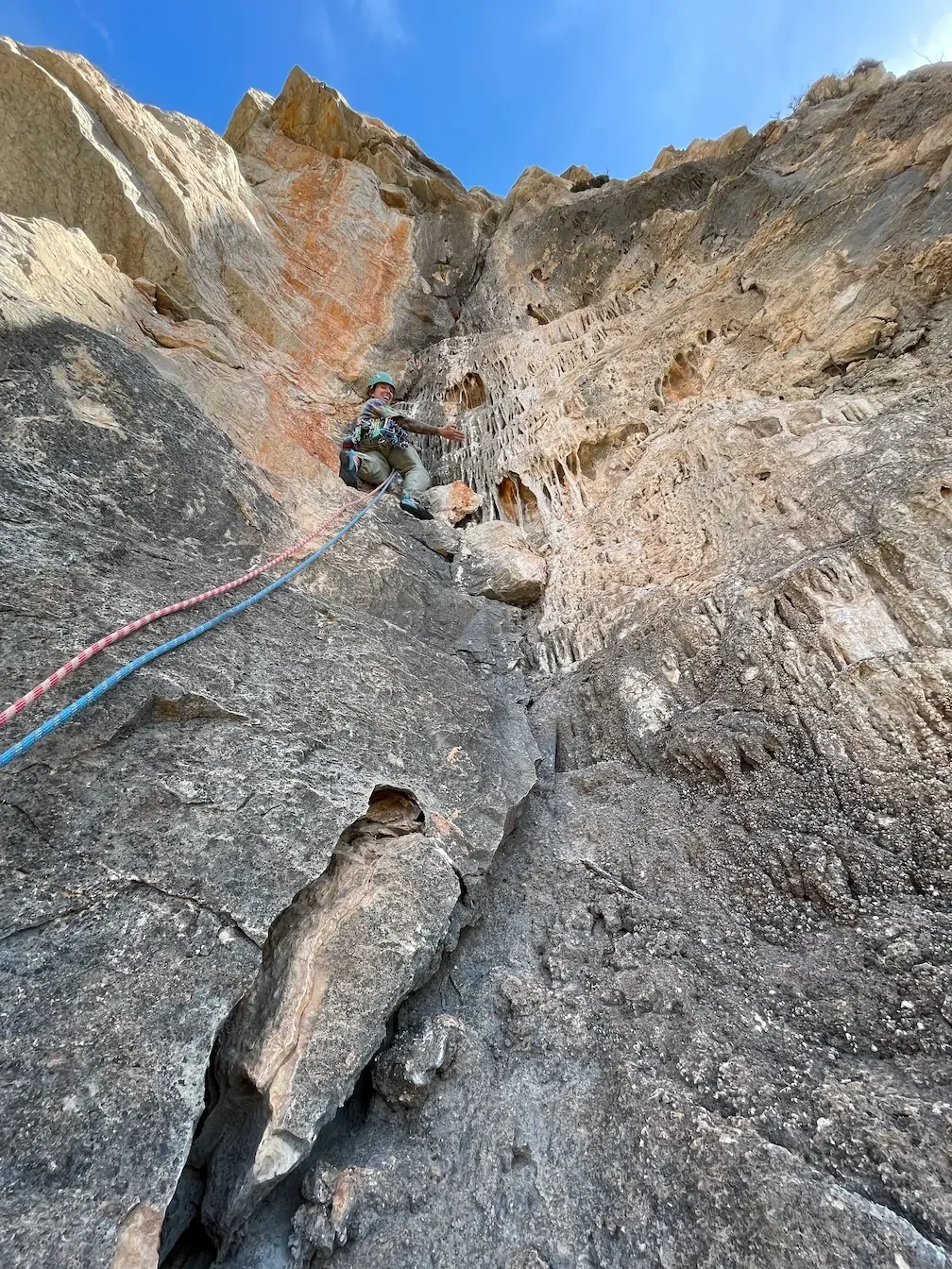 Climber on a limestone route in Granada during a guided trad climbing session