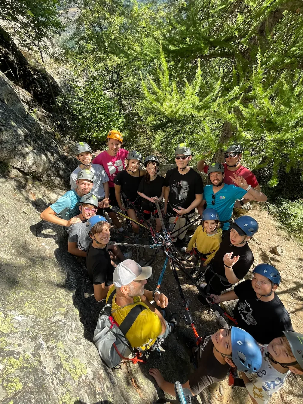 Bunch of Climber enjoying via ferrata during an adaptive climbing course