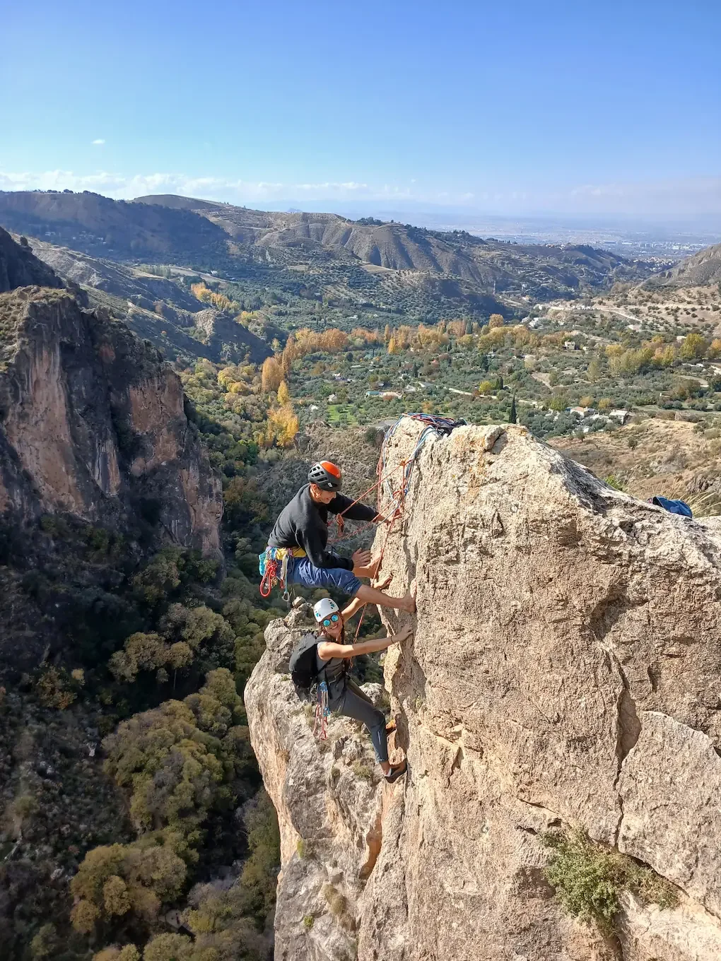 Guide belaying climber on multi pitch route in Granada