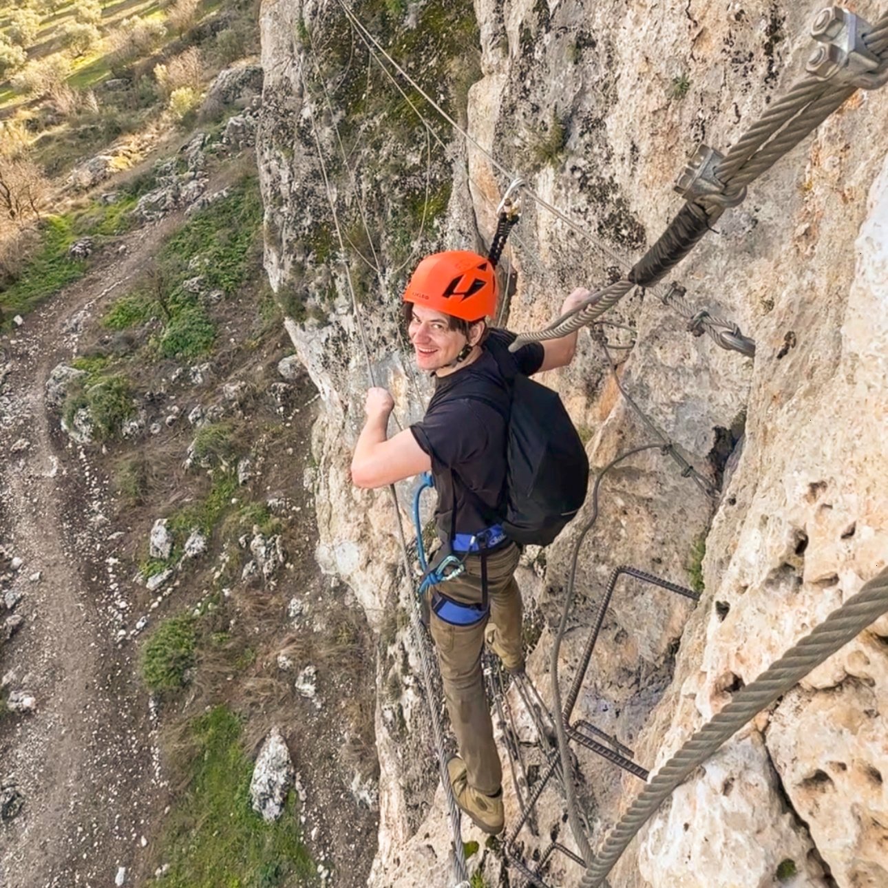 A guys smiling, enjoying a nice via ferrata around Granada