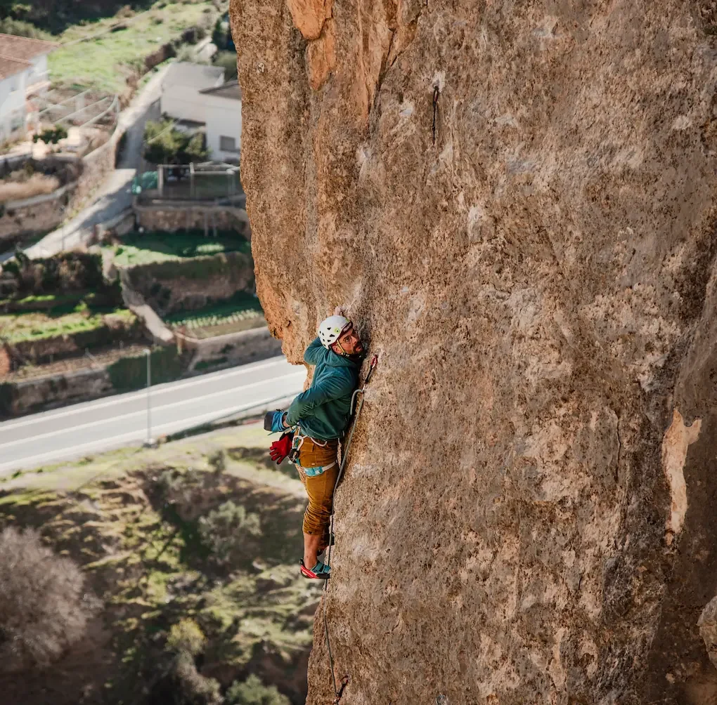 Climber climbing in Granada area, focus on slab