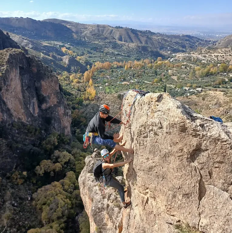 A climber and her guide having good time Climbing Multi Pitch in Monachil