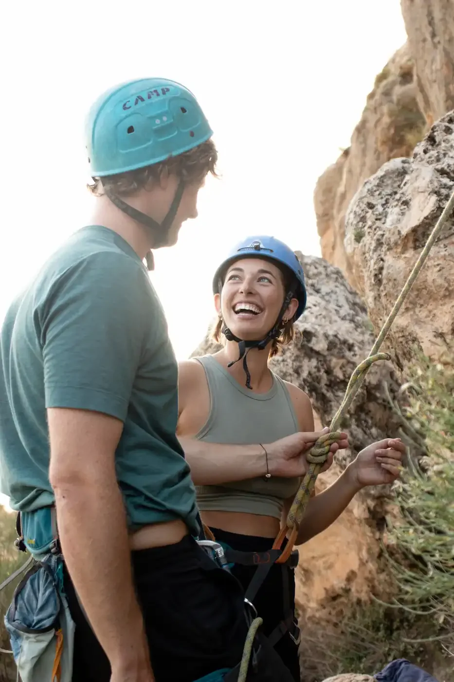 Climber learning basic techniques in a beginner climbing course in Granada