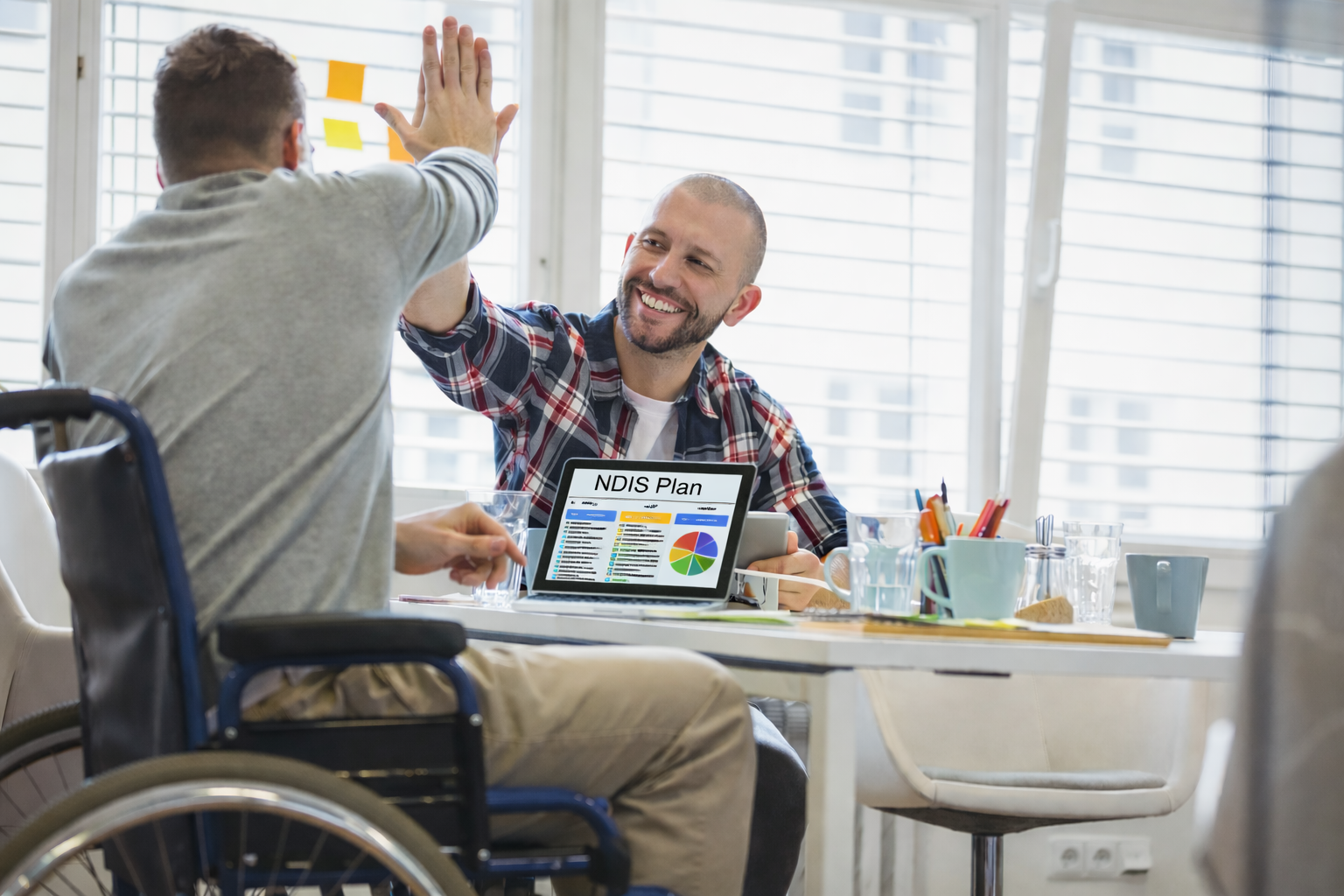 Support Coordinator working with a participant to understand and organise their NDIS supports