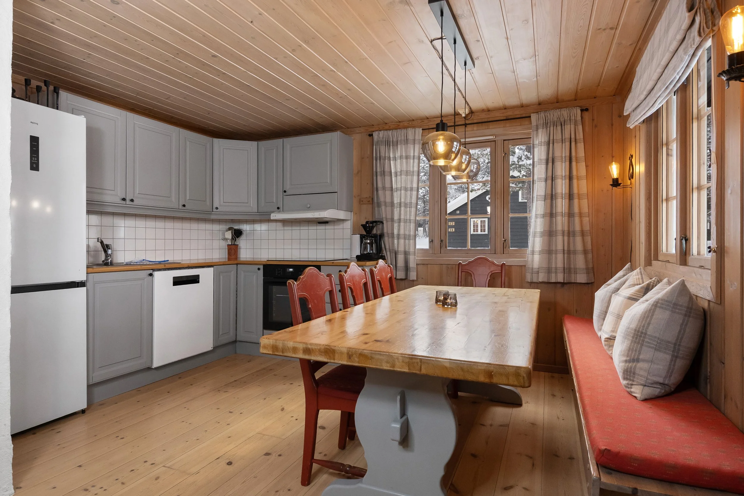 Open kitchen with large dining table. Photo