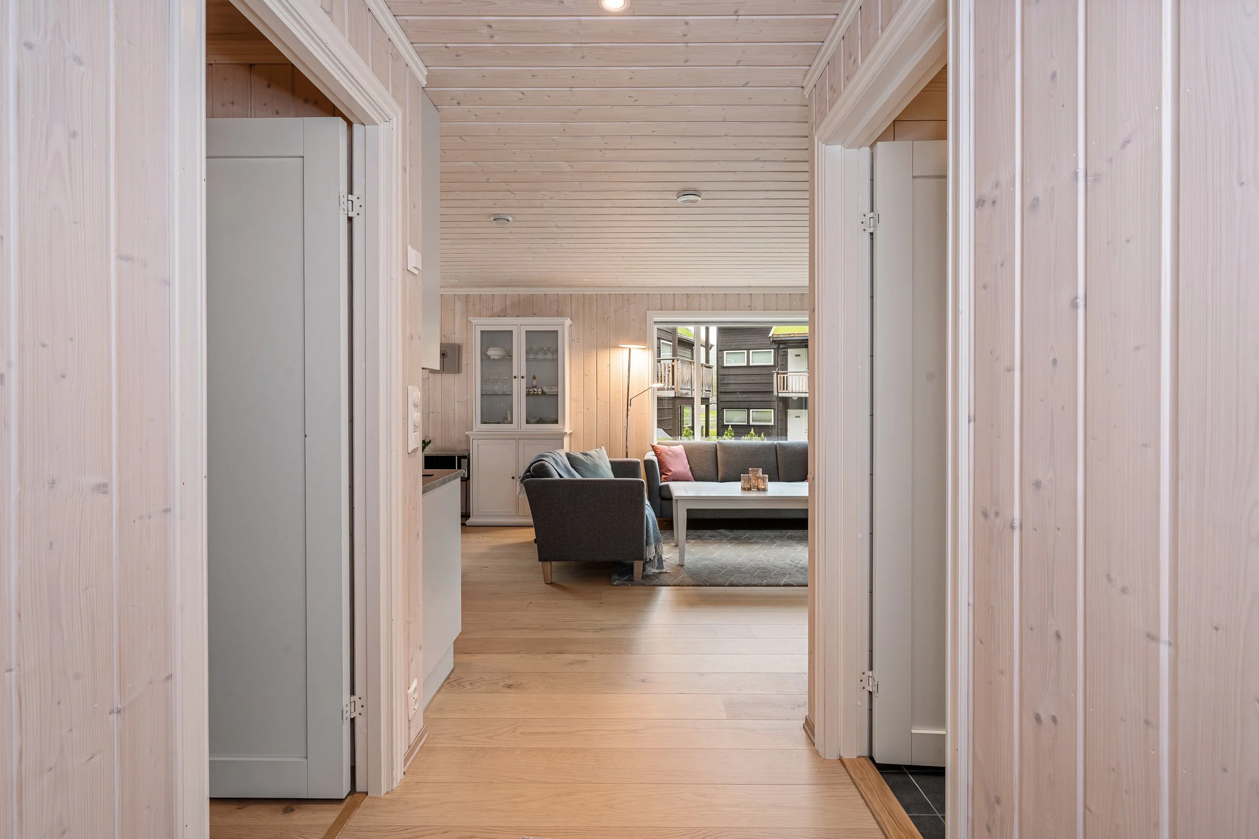 Open hallway leading to the living room. Photo
