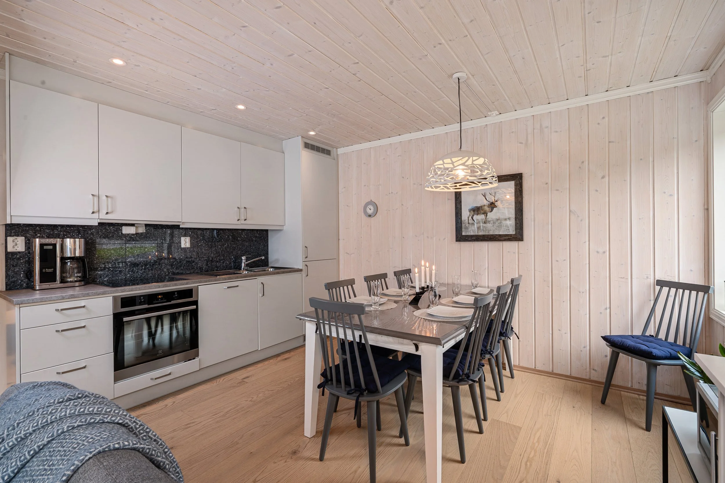 Bright kitchen with dining table. Photo