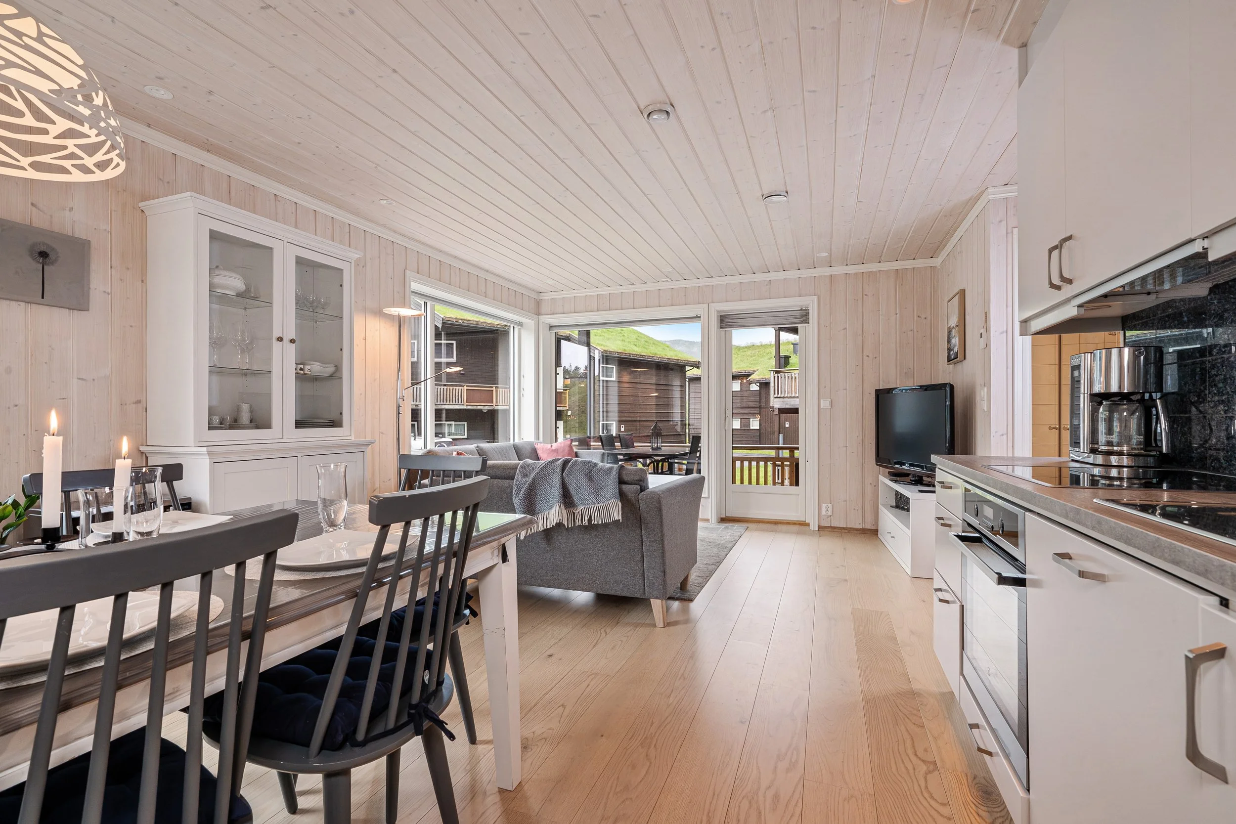 Open living room and kitchen in a bright apartment. Photo
