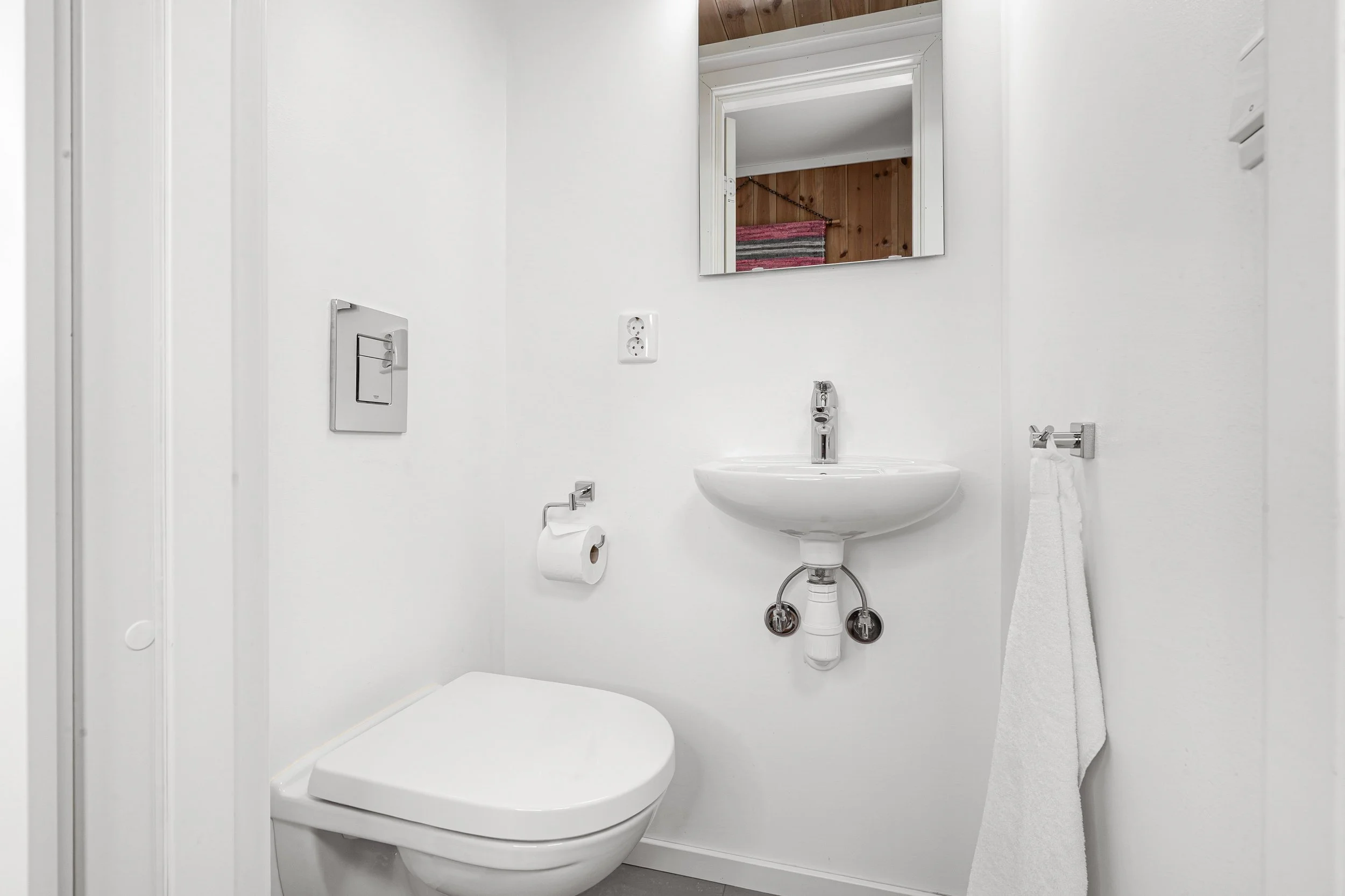 Bathroom with toilet and sink. Photo
