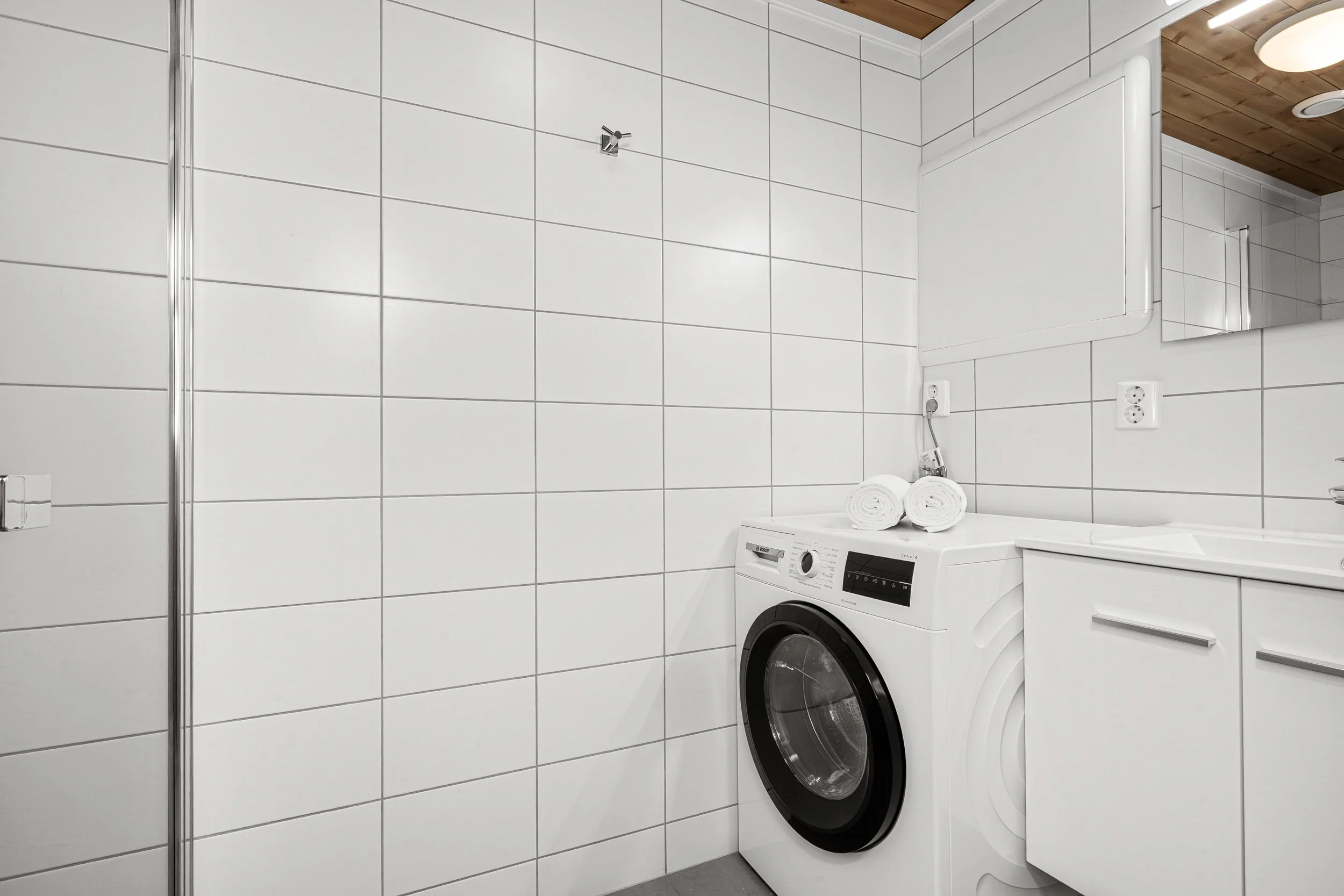 Laundry room with washing machine. Photo