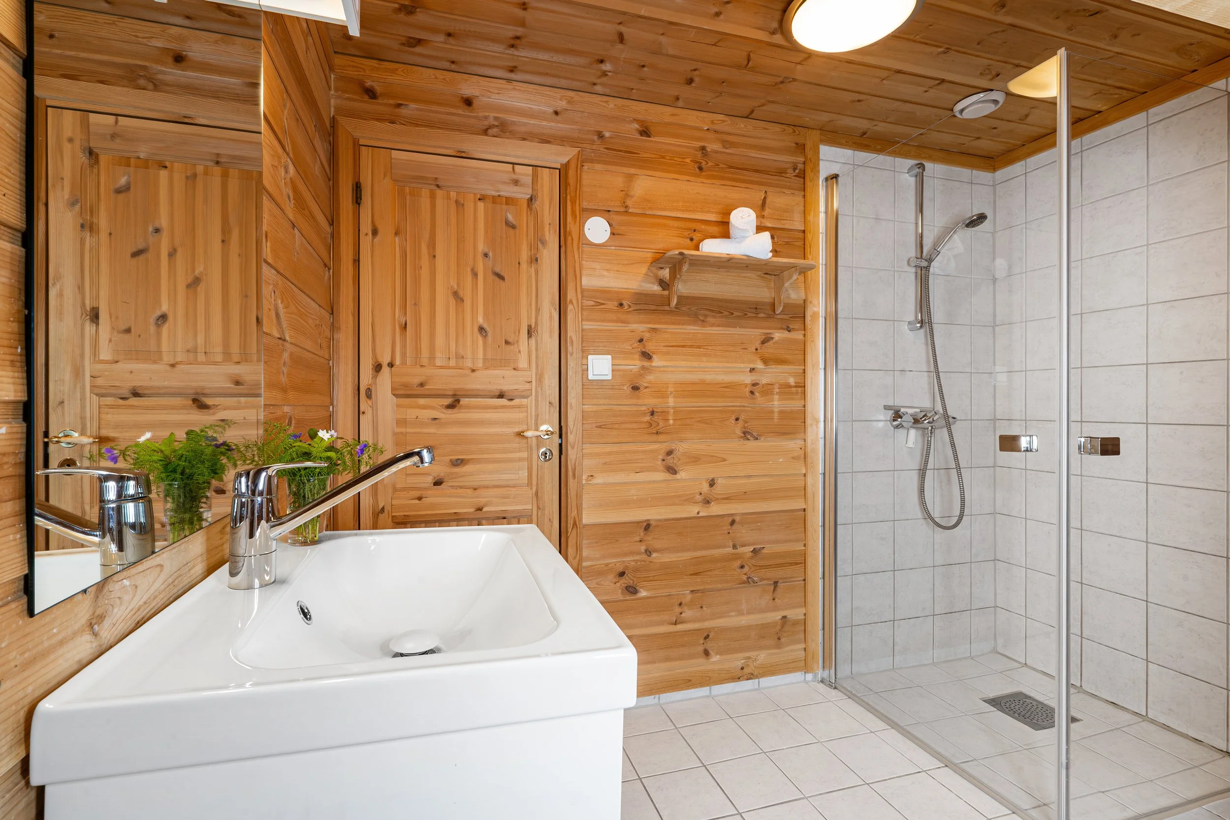 Bathroom with shower and sink. Photo