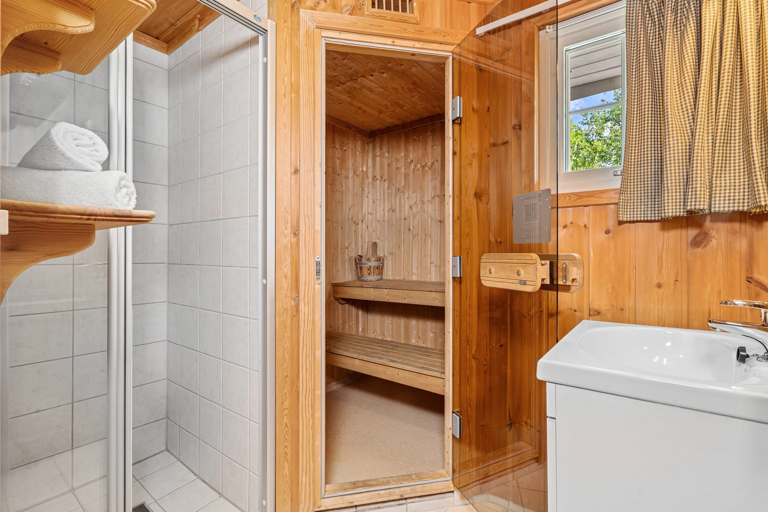 Bathroom with shower and sauna. Photo