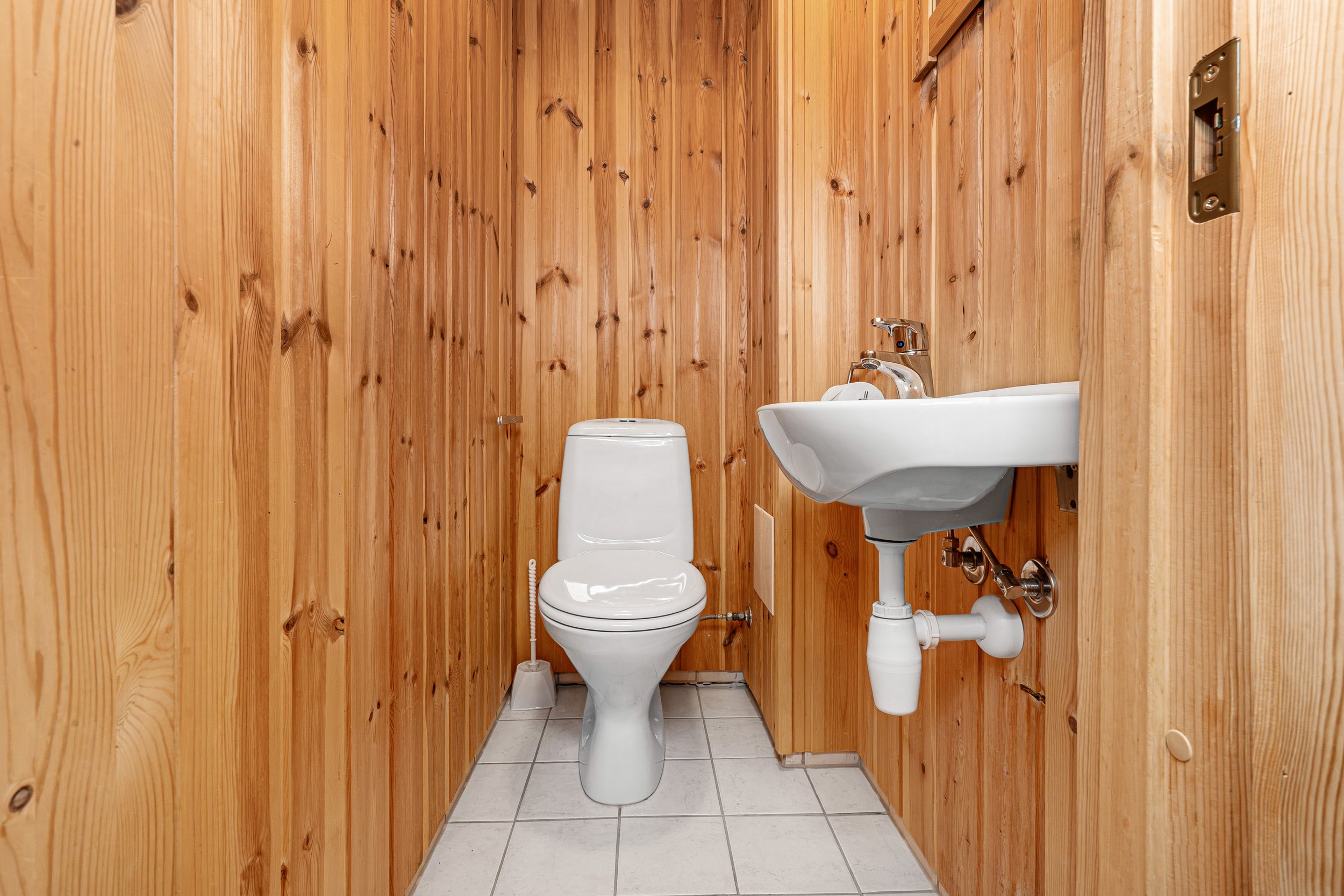 Bathroom with toilet and sink. Photo