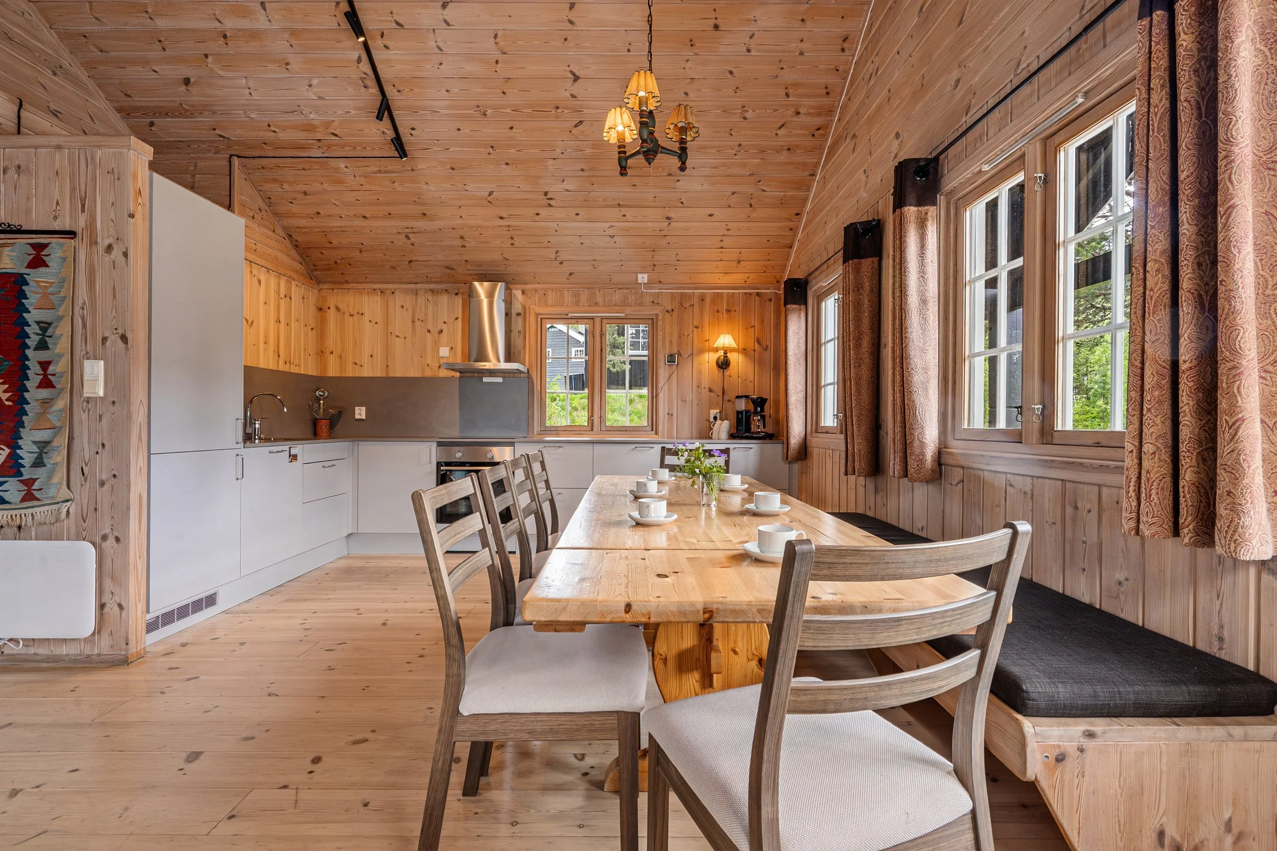 Large dining table in open kitchen. Photo