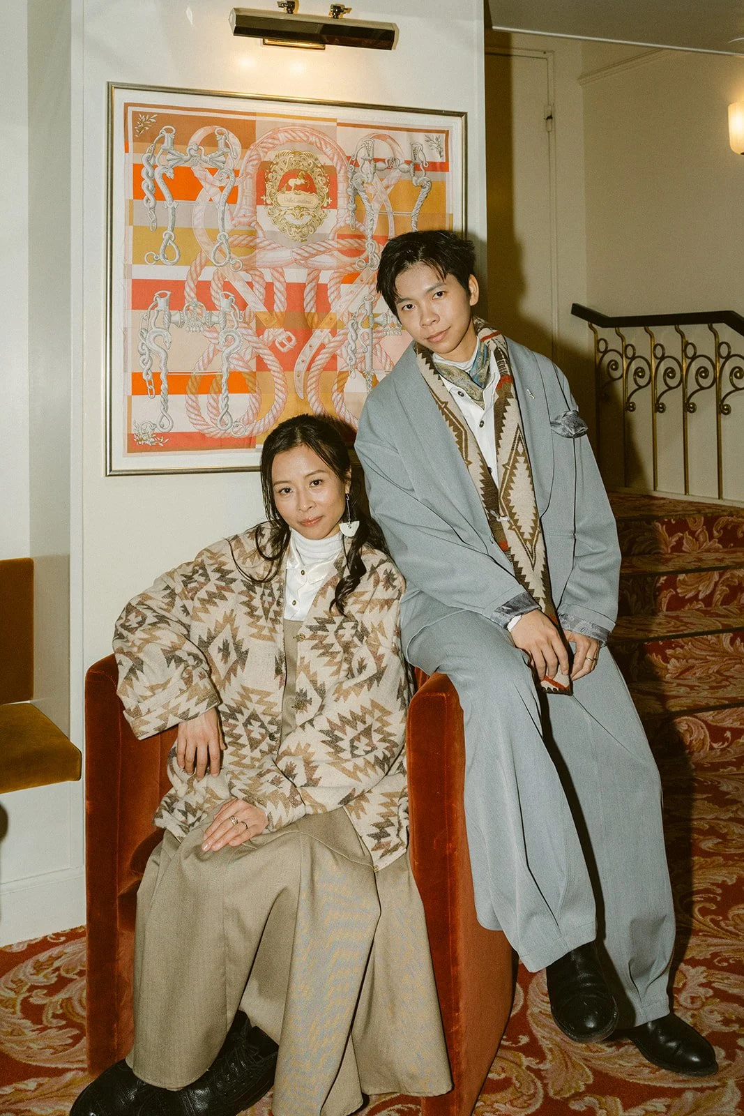 Same sex lgbtq+ couple in cafe hotel on their wedding day in denmark portrait.jpg