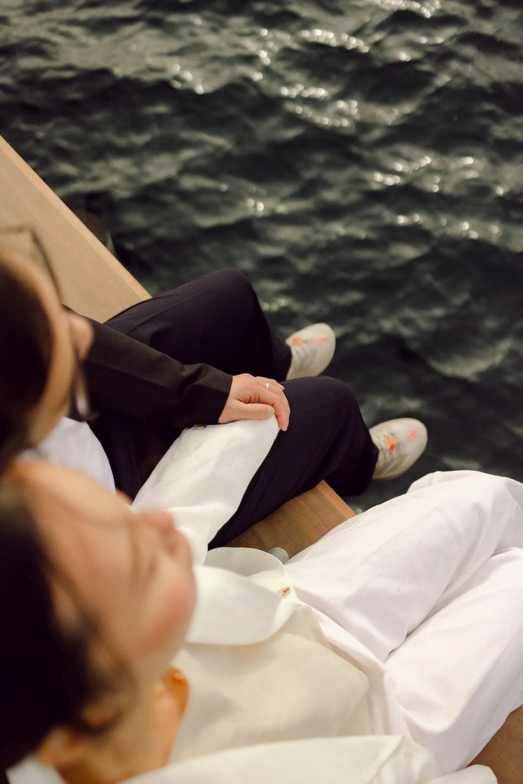 Bride and groom kissing by the harbour after getting married in denmark in copenhagen Reffen sunset hour.jpg