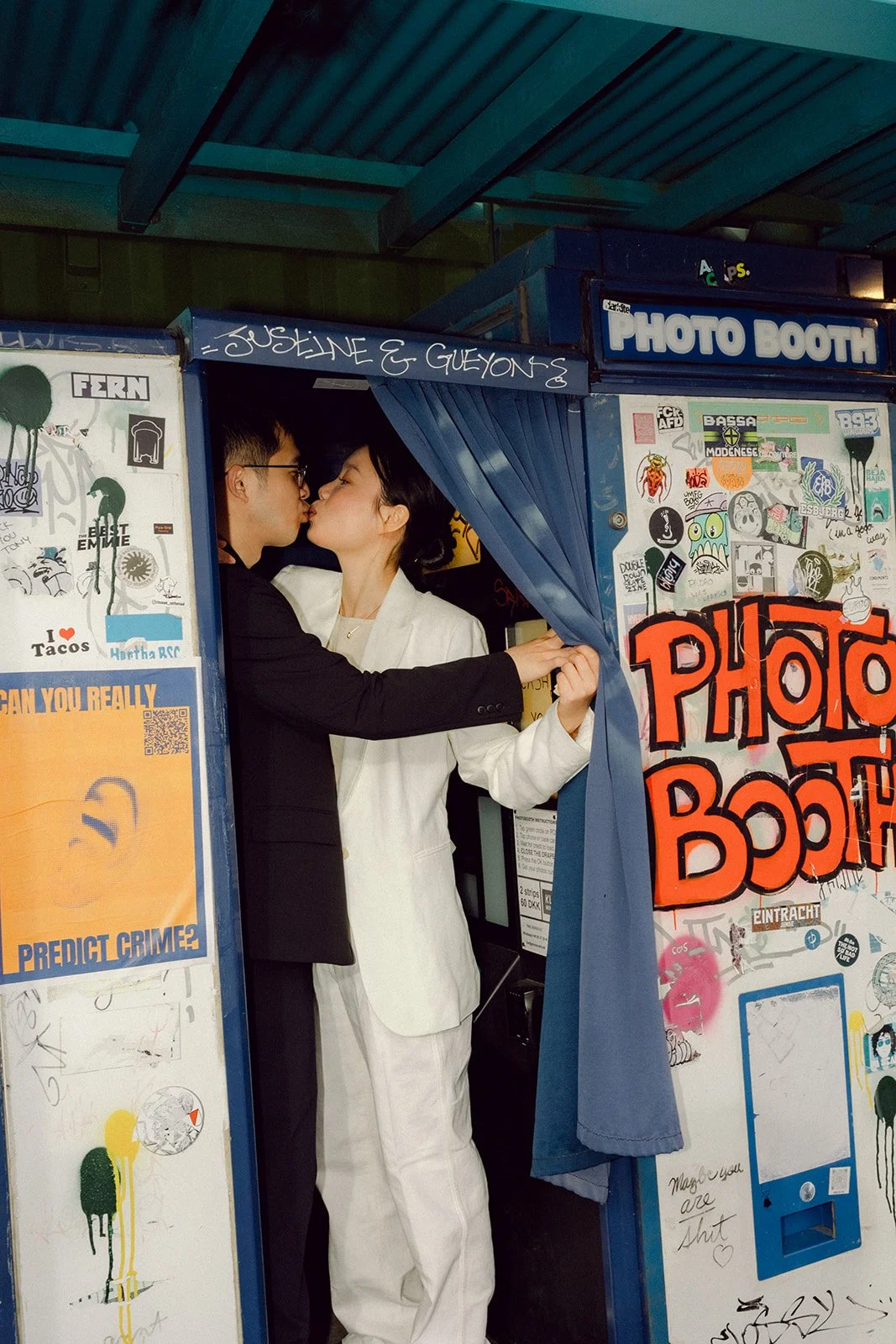 Bride and groom kissing in the photo booth after getting married in denmark in copenhagen flash.jpg