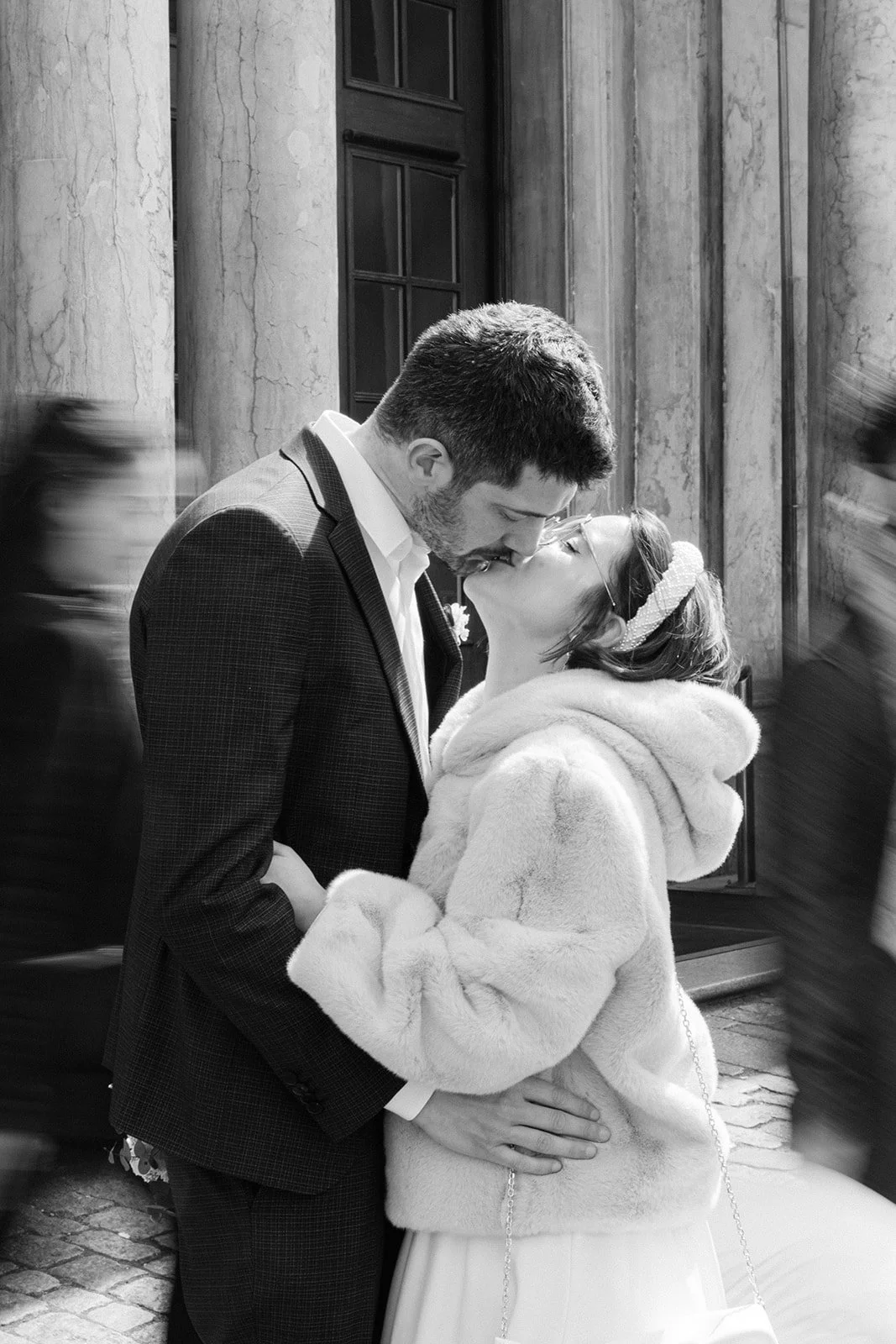 bride and groom kissing in copenhagen black and white motion blur.jpg
