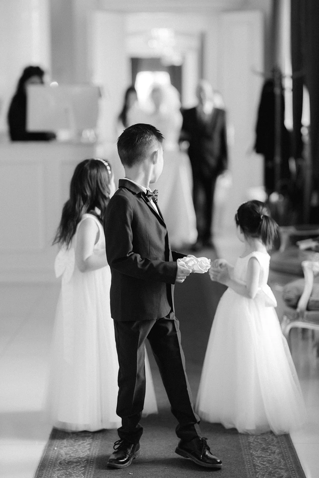 Bridal portrait at a Danish estate wedding venue, captured in a natural documentary style by Copenhagen wedding photographer DreamSonder walking down the aisle with her father black and white