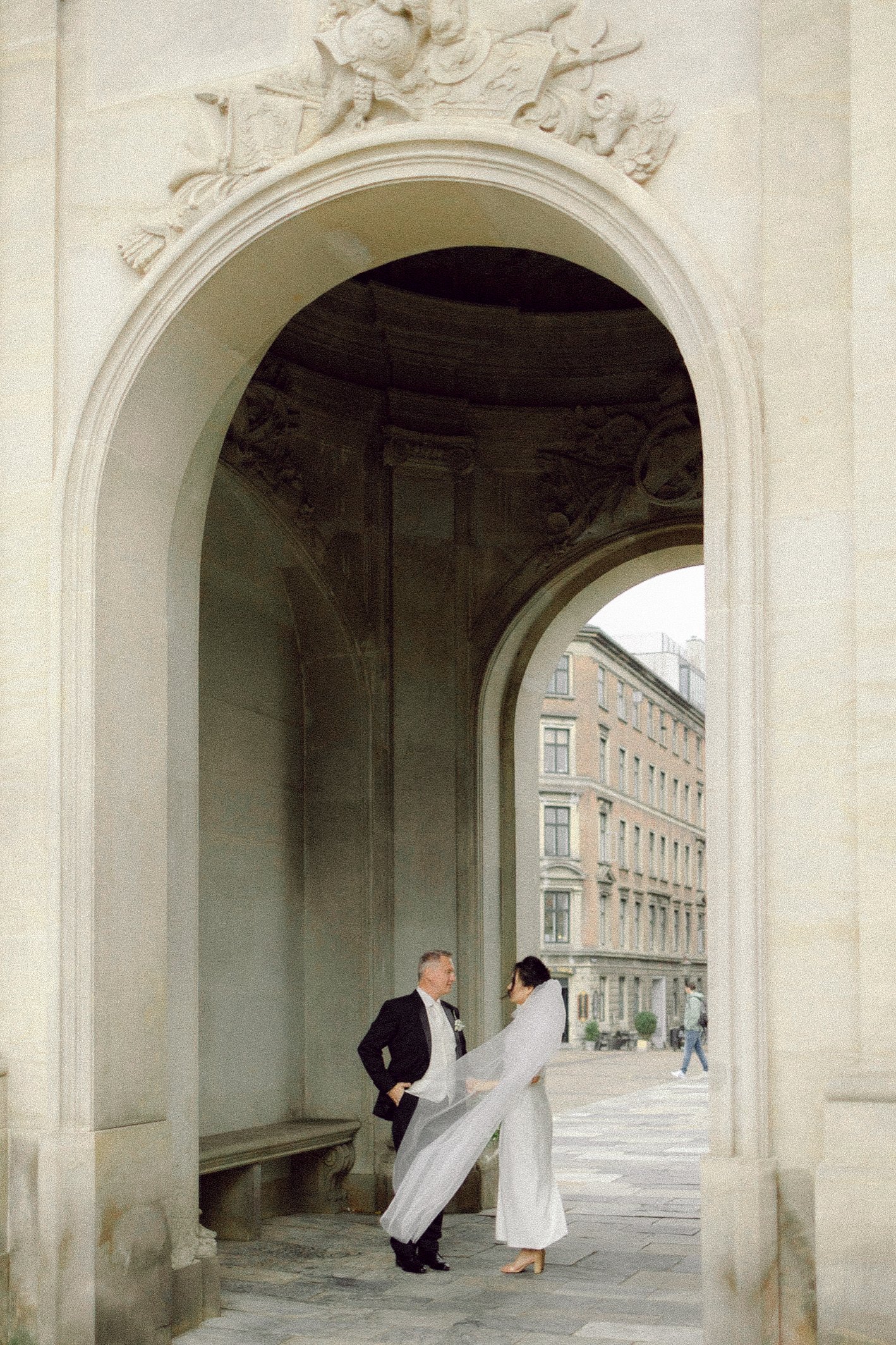 city hall wedding copenhagen denmark couple walking standing smiling kissing