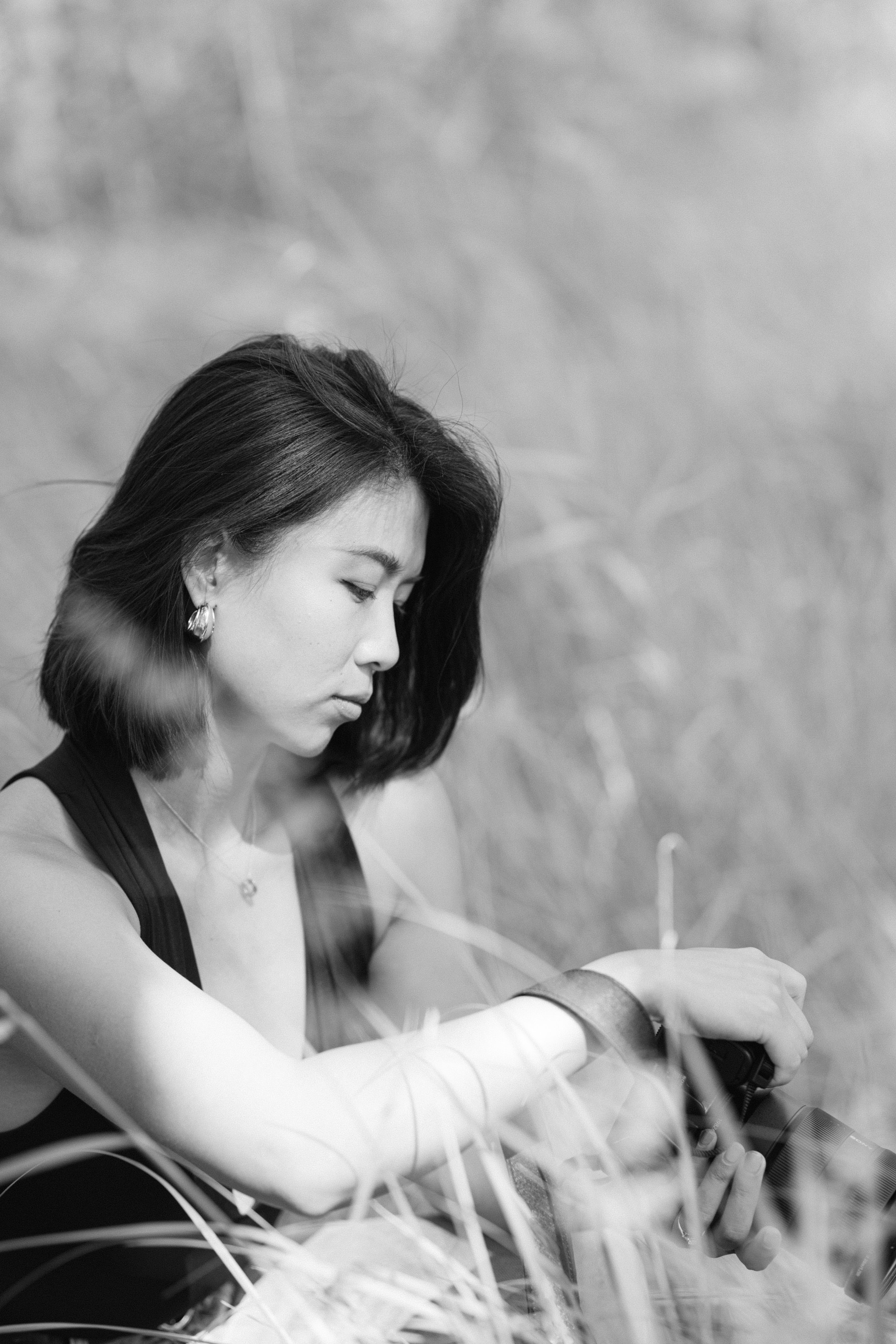 portrait of dreamsonder suzan wang wedding photographer who is looking into her camera black and white