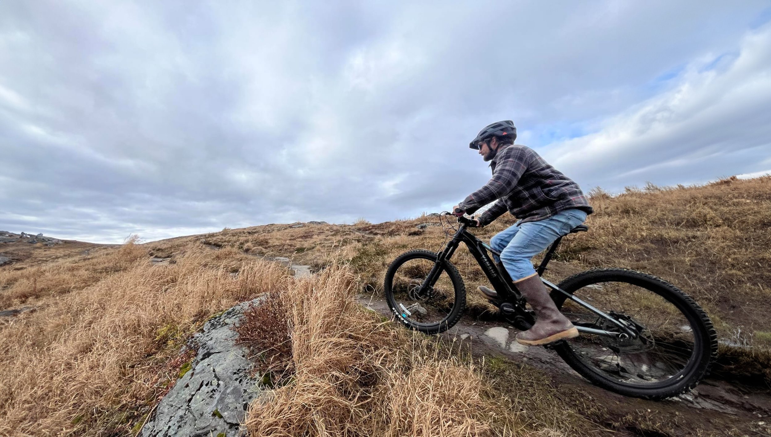 Man Riding Over Small Hill 1.jpg