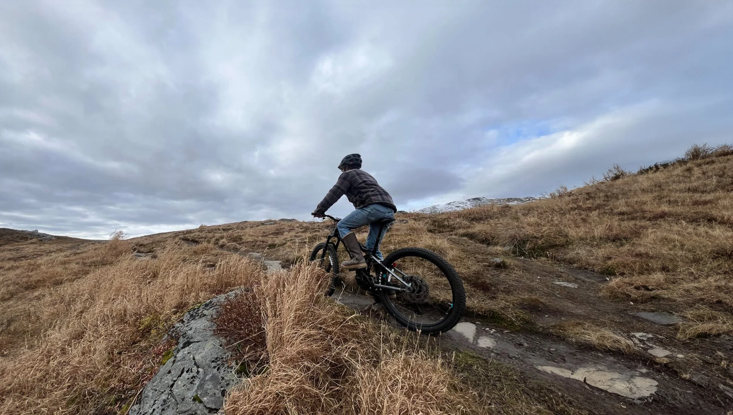 Man Riding Over Small Hill 2.jpg