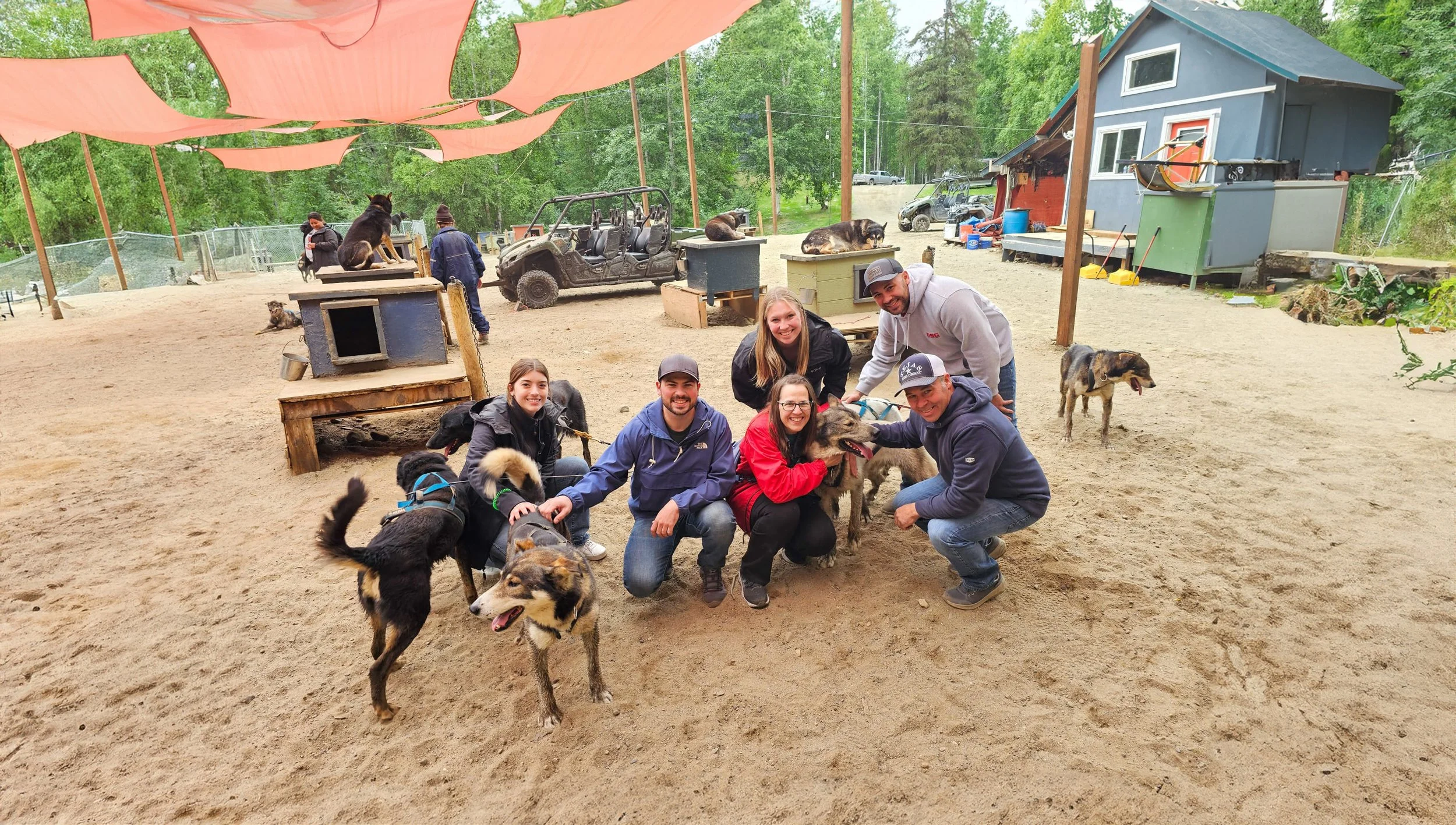 Family With Huskeys Under Tarp.jpg
