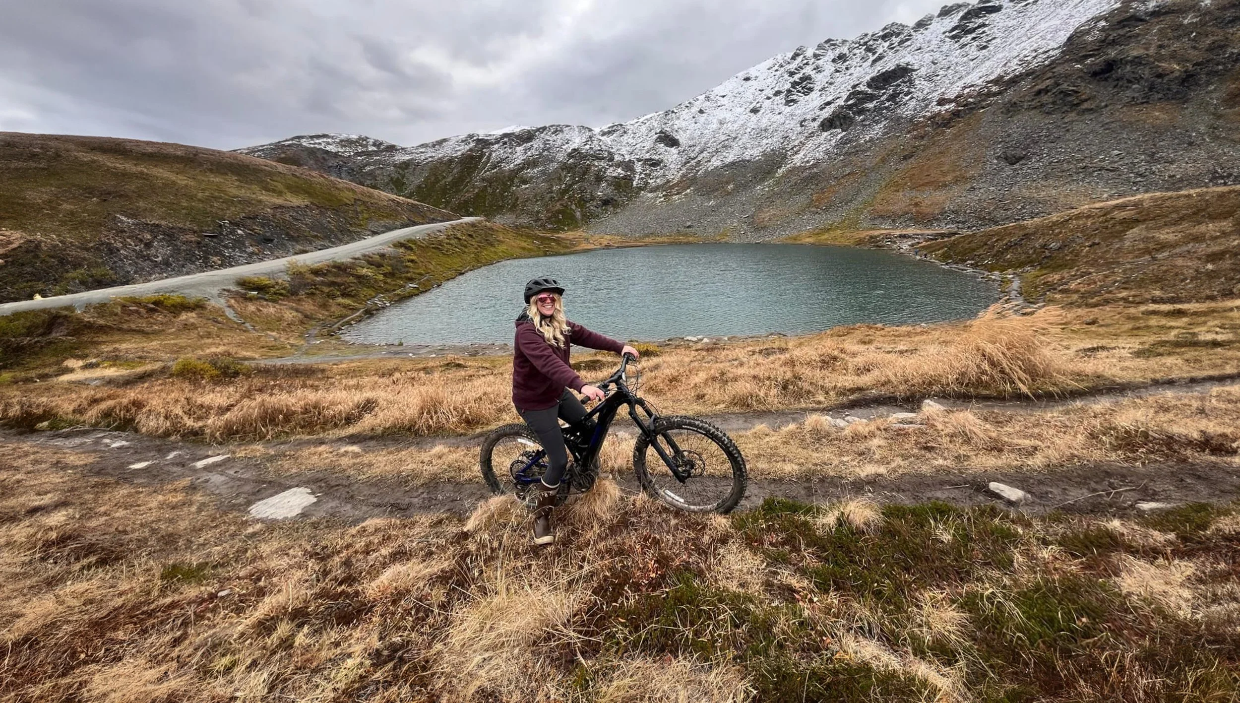 Woman By Small Lake On Bike.jpg