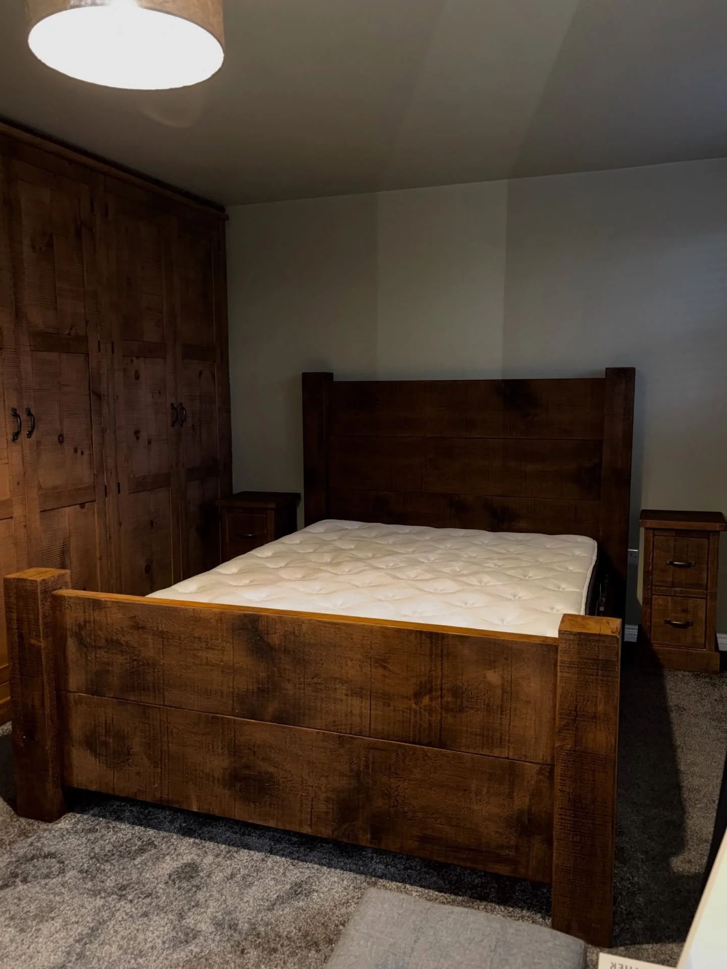 Recently delivered.

This stunning rough sawn plank bed, finished in our medium wax.

Nicely accompanied by two bedsides with metal bar handles.

All sat next to one of our fitted wardrobes that the previous owner of the house had put in.

When we sa