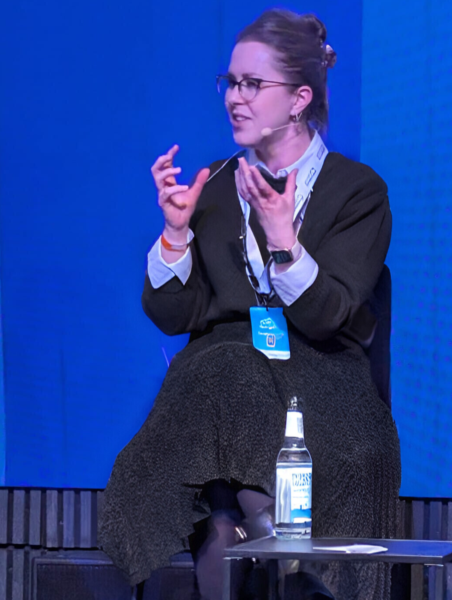 Julia Bandov speaking on a panel at the Freelance Unlocked conference about combining parenting and entrepreneurship.