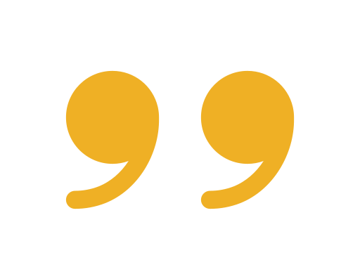 Close-up of a yellow quotation mark symbol on a black background.