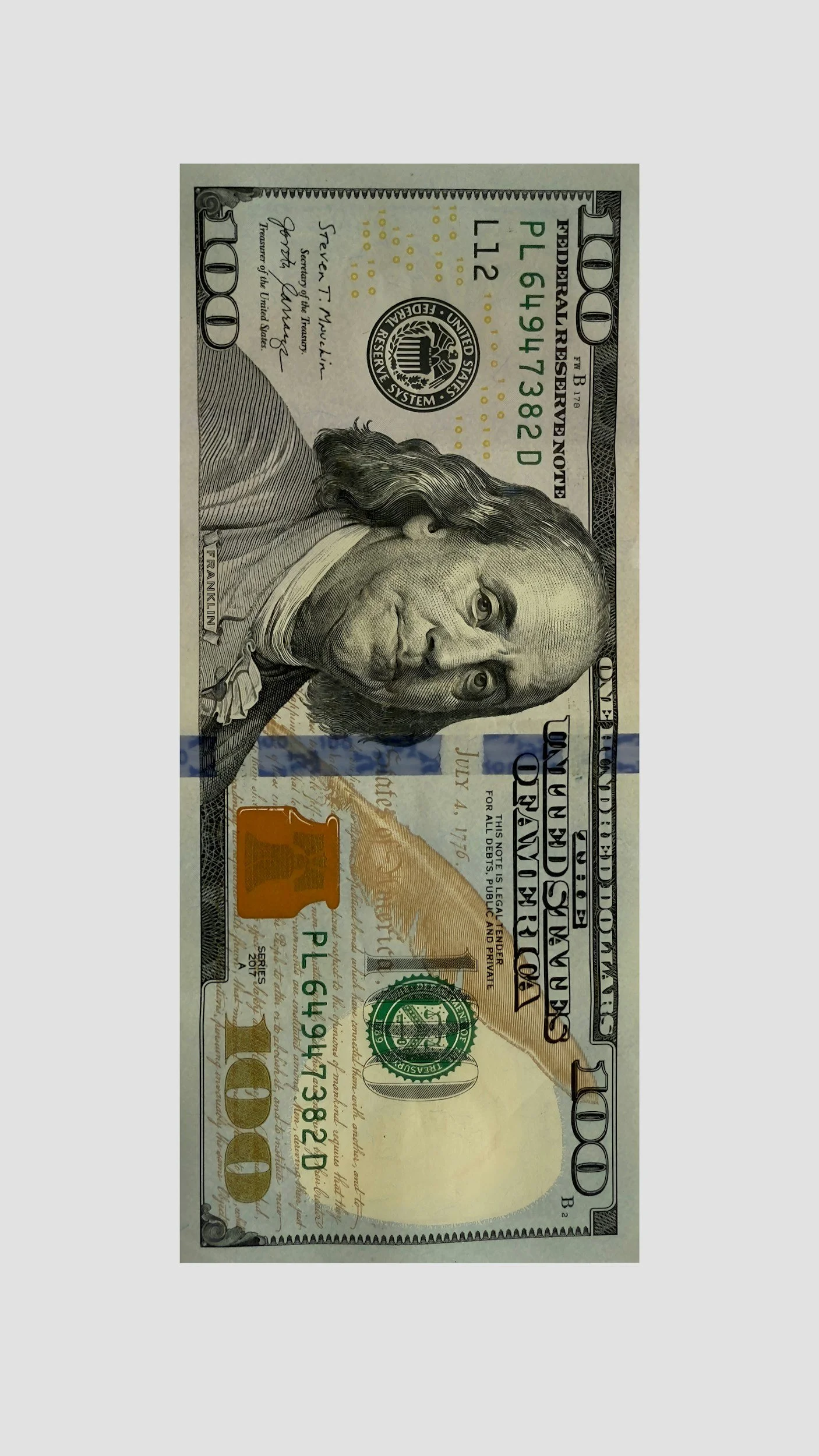 A hundred-dollar bill featuring Benjamin Franklin's portrait.