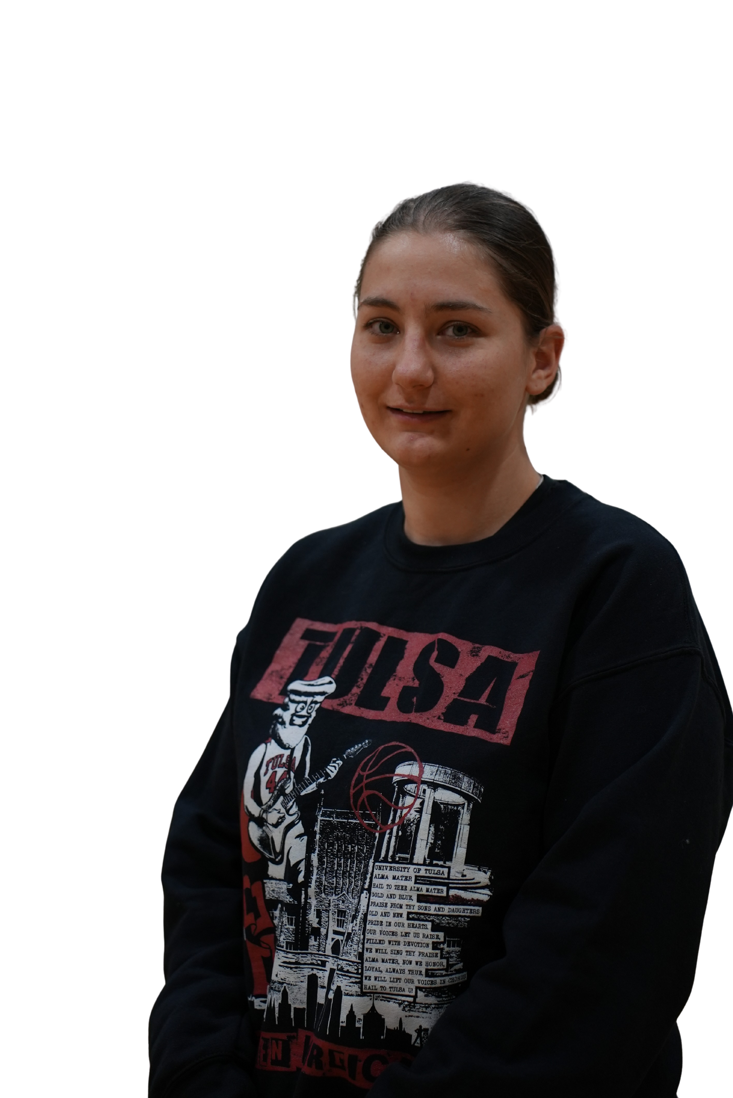 Young woman with brown hair tied back, wearing a black sweatshirt featuring the band 'Fugazi' and graphic artwork.