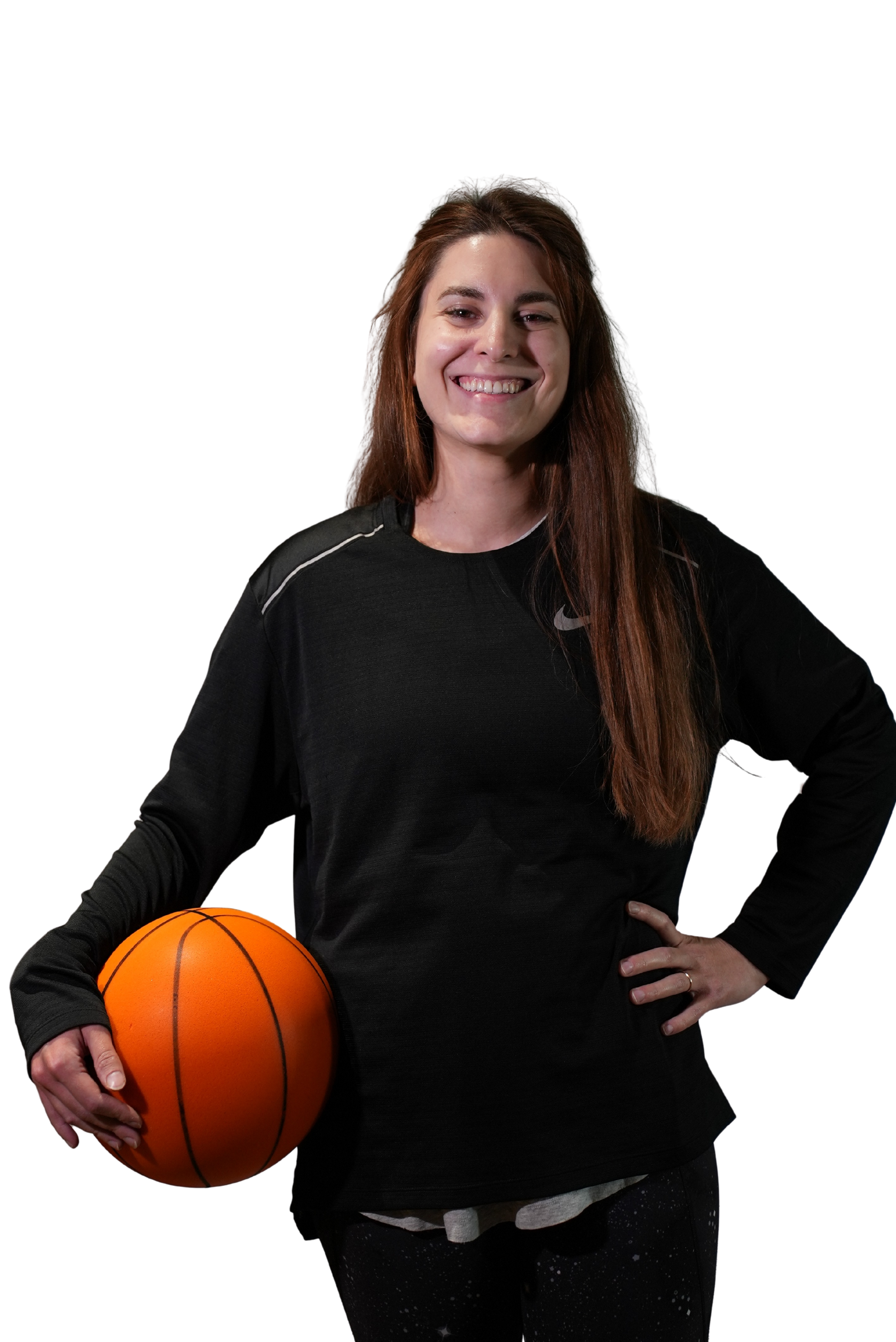 A woman smiling while holding a basketball and wearing a black sports jersey.