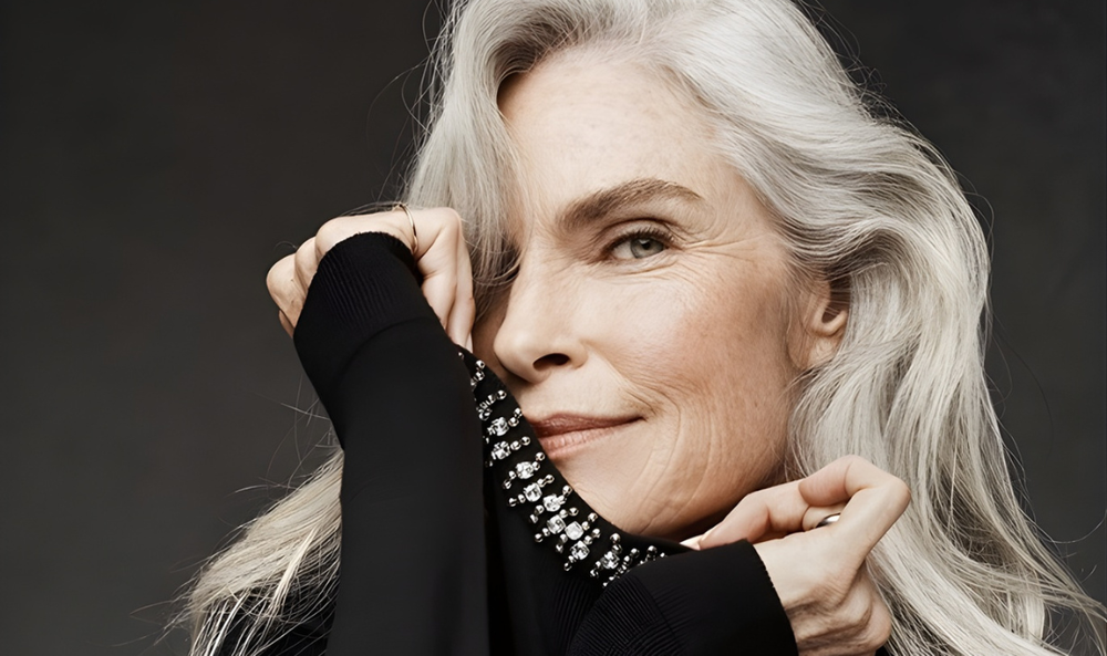 Silver-haired creator in an editorial portrait